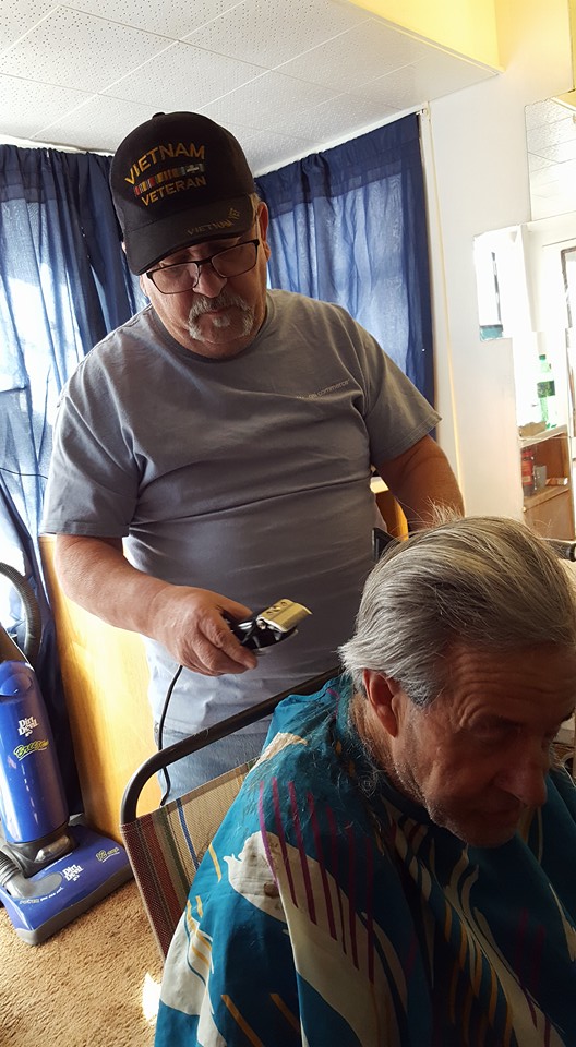 Bob gives Steve a haircut at his new apartment. Photo courtesy of the Mellos.