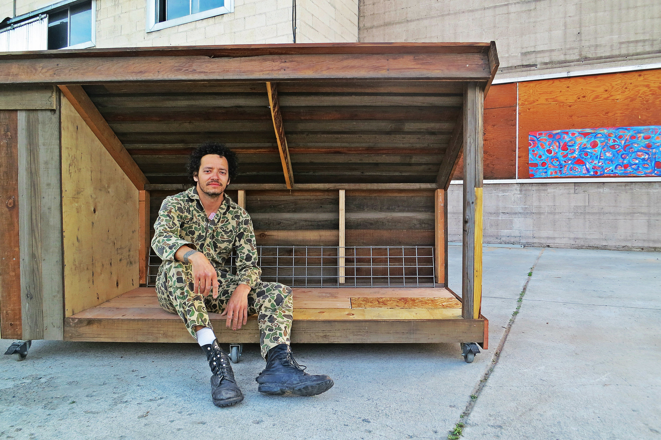 Chris Wyatt Scott is worn down, but satisfied, as he completed an extremely sturdy, functional, and nicely designed "teeny house" complete with a lockable storage box in just one day with discarded wood and materials.