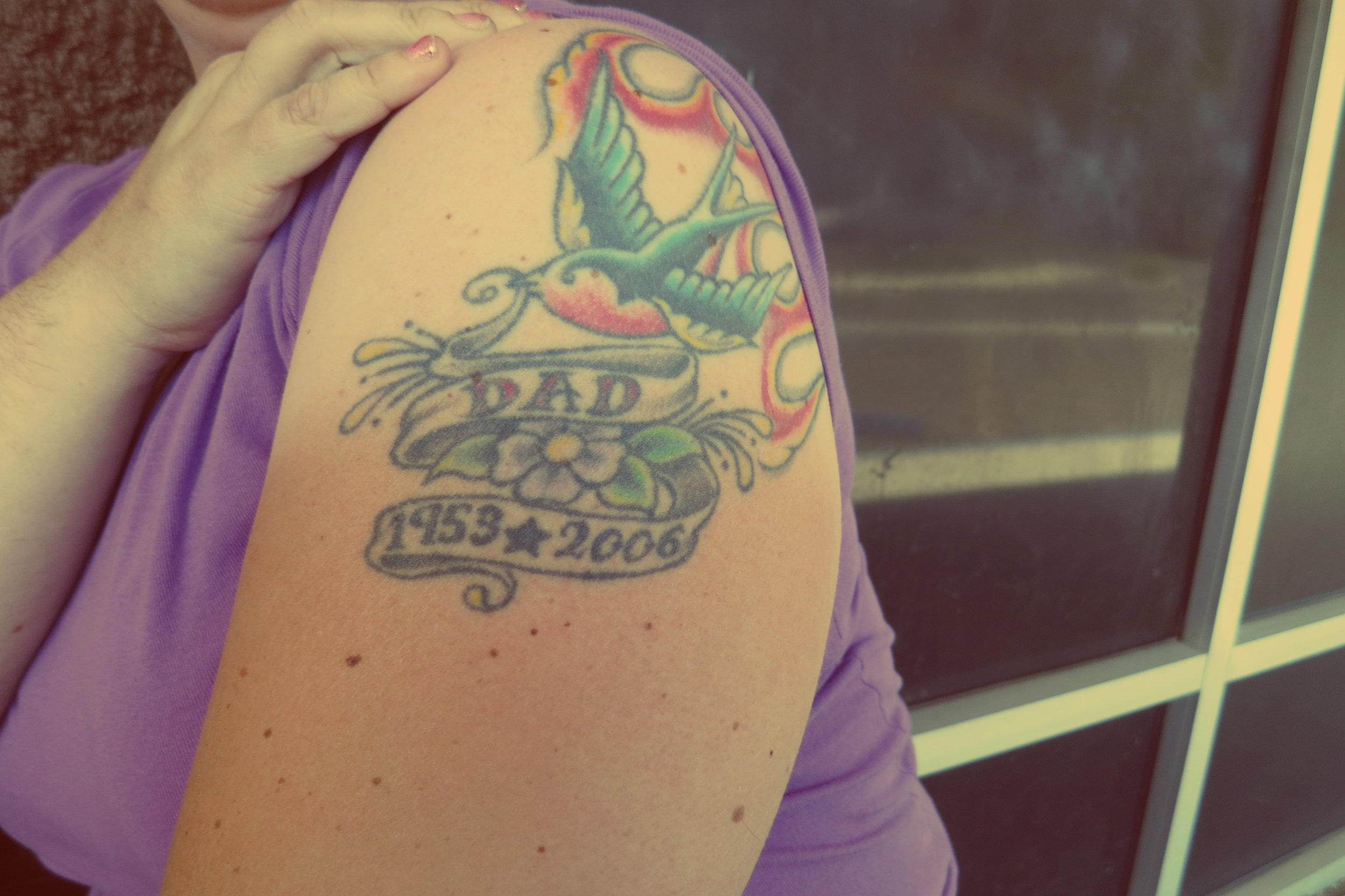 A tattoo in honor of her Dad. He "was homeless because he wanted life to be as uncomplicated and free from obligation as possible," she was quoted as saying in an article shortly after his death.