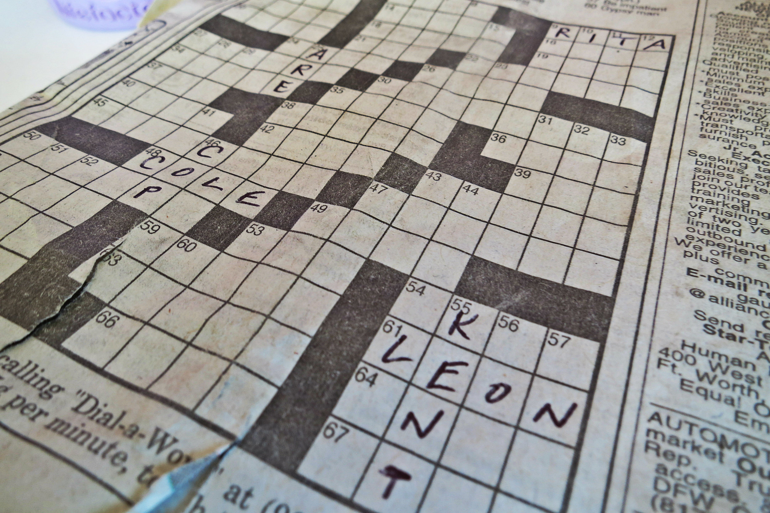 The unfinished crossword puzzle with the neat handwriting went back in her Dad's old bags, as we finished the interview.