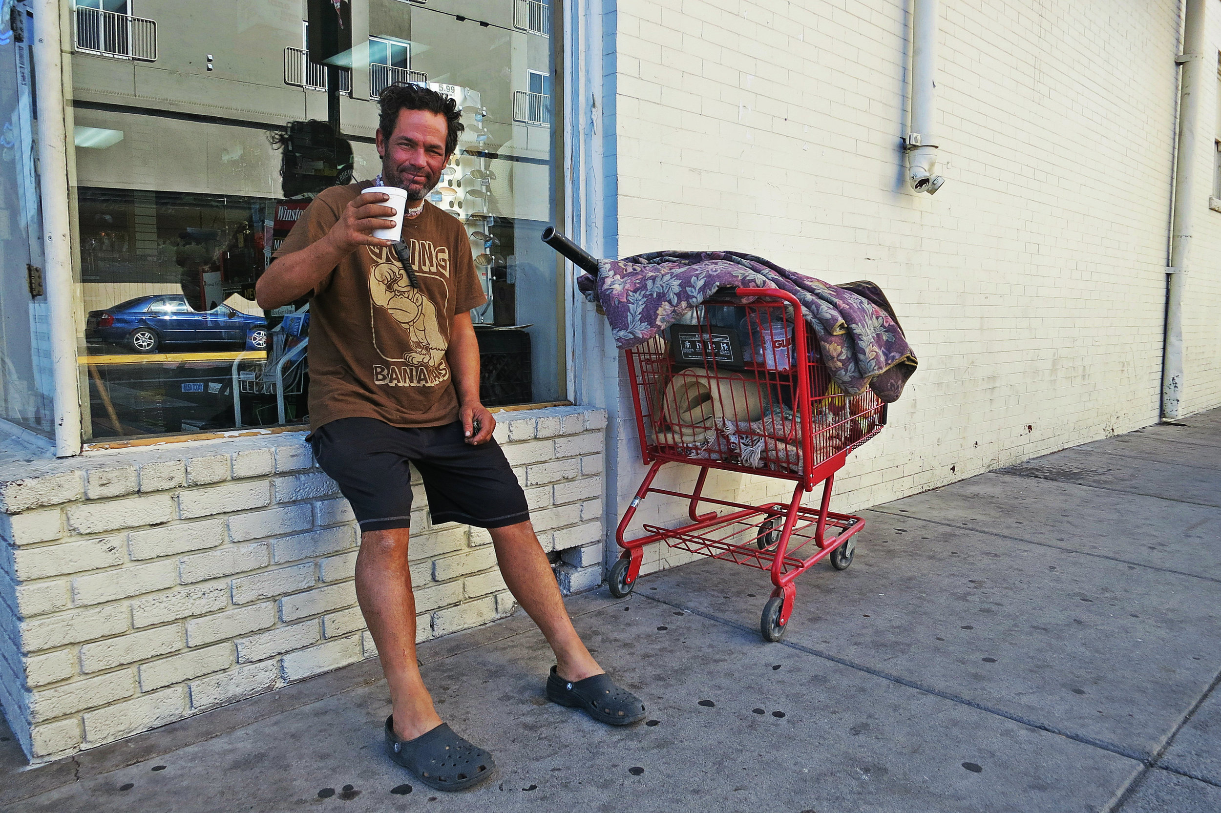 "I’m just holding on to my life,” Christian says of recently being robbed of many of his possessions after getting some money from a passerby to get some coffee.