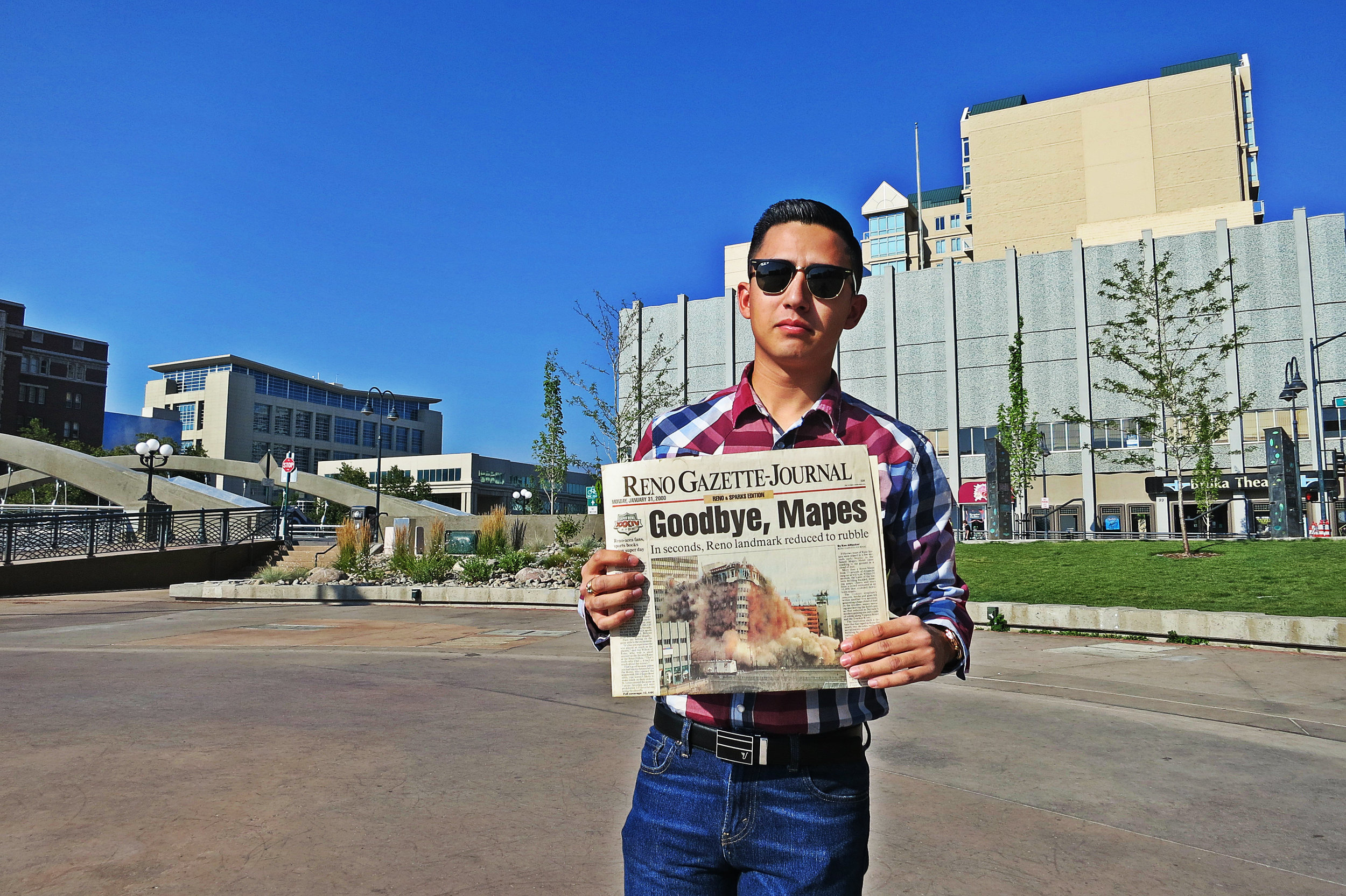 Hagen holds the Reno Gazette-Journal covering the Jan 30, 2000, demolition, which took just a few seconds and 75 pounds of dynamite to wipe out more than 50 years of history.