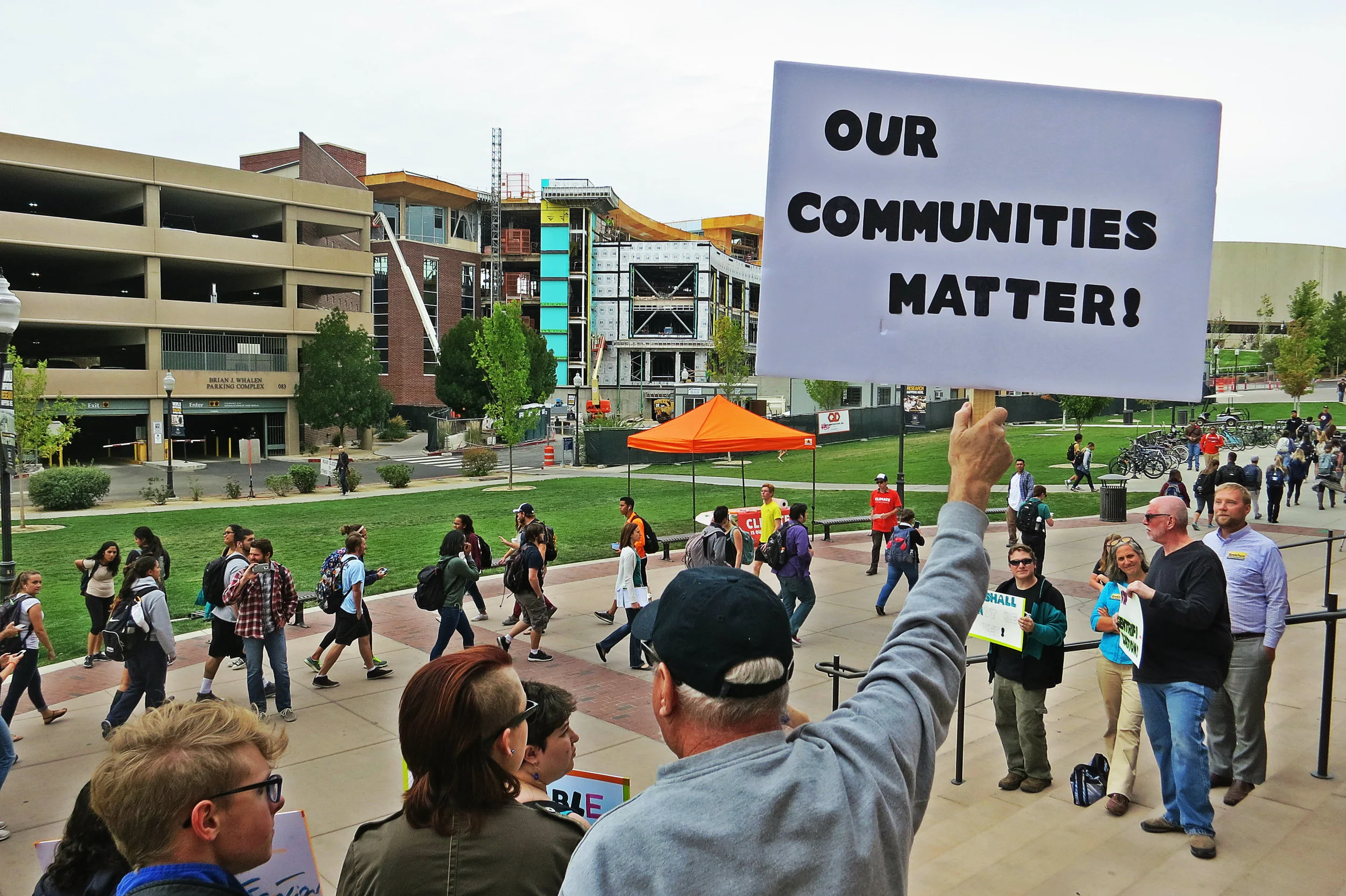 Dozens of students, faculty and activists took part in the rally, with a new UNR gym still in construction as backdrop.