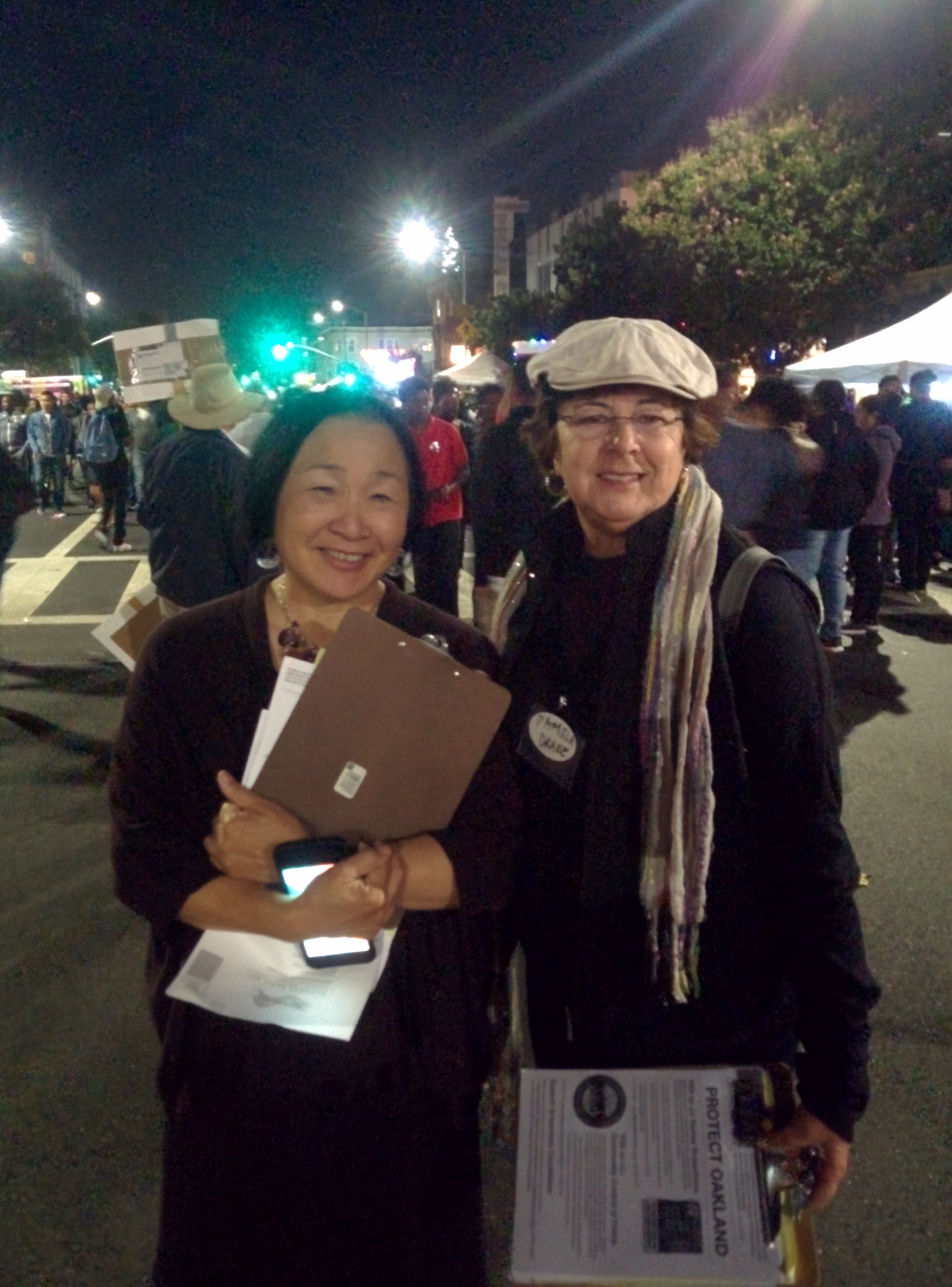 Jean Quan (left) during an Oakland First Fridays Festival, campaigning for a renter protection ordinance, had advice for a city like Reno beginning to experience its own gentrification issues. Photo by Ruben Kimmelman