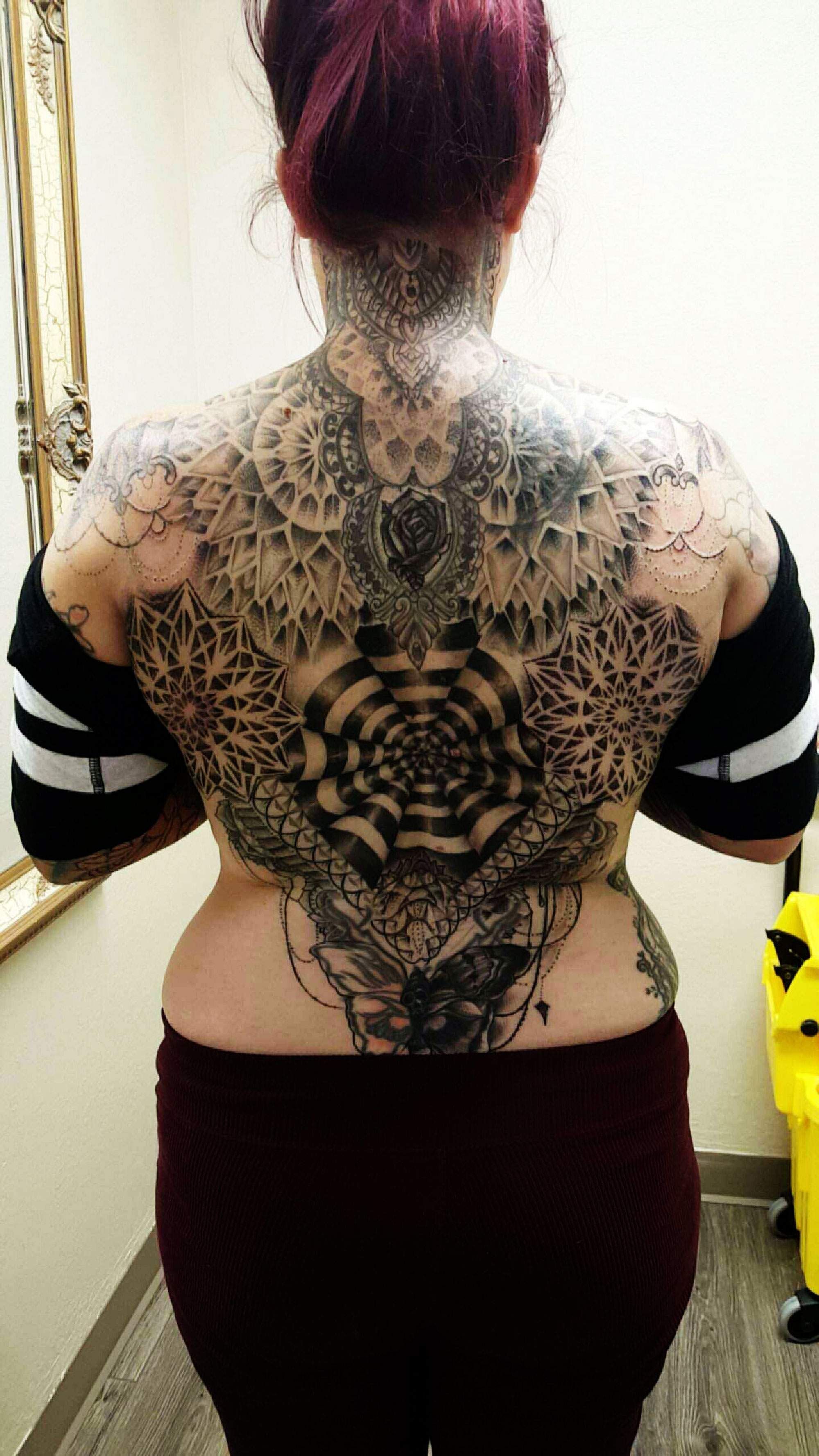 Moore is booked out with about three, four customers a day. This back Mandala piece (many times defined as a geometric figure representing the universe through symbolism) has so far taken her 24 hours, and will be completed after another 8 hours of work. 