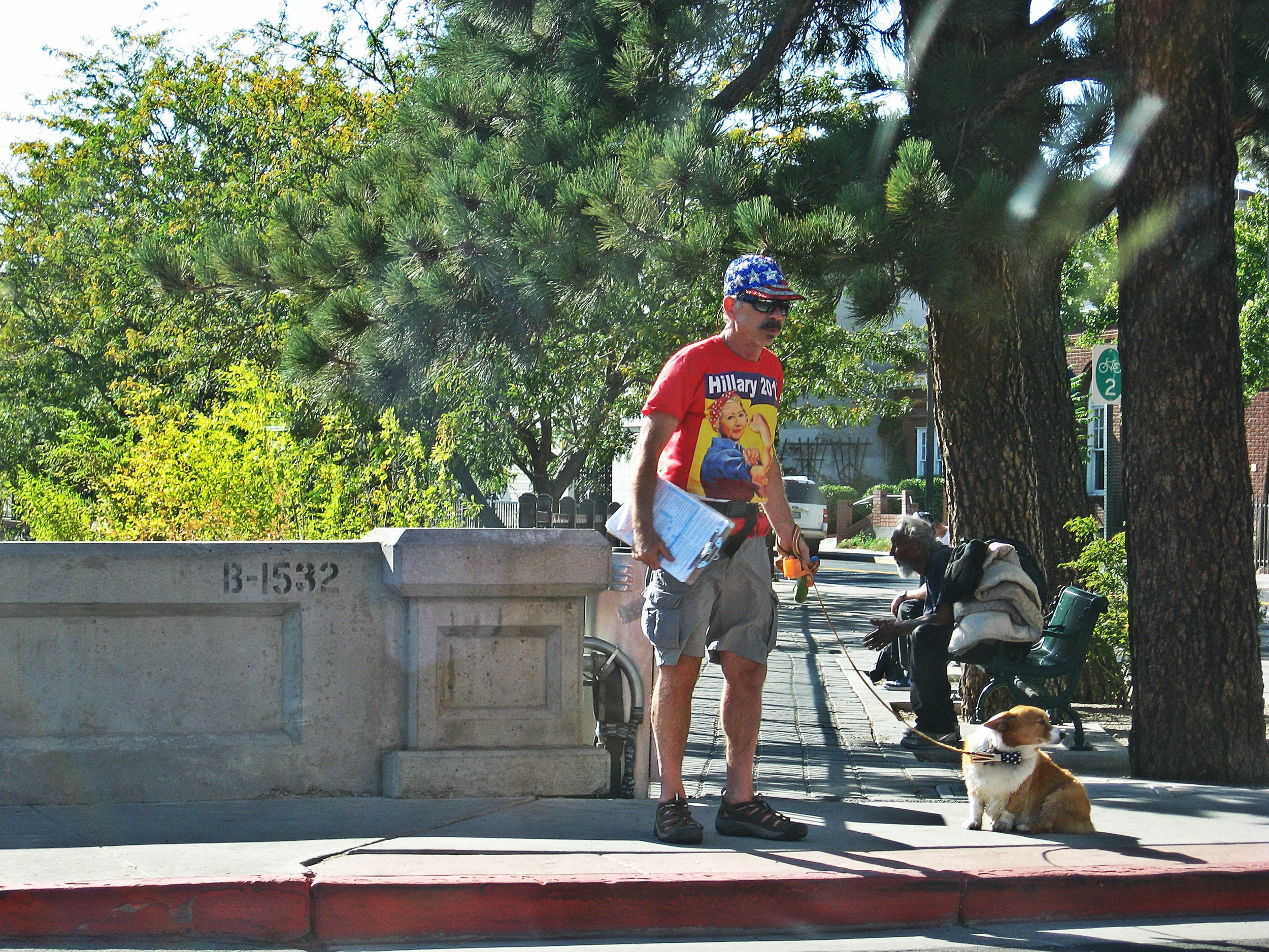 A get out the vote volunteer supporting Hillary tries to sign people up in downtown Reno. Photo by Nico Colombant