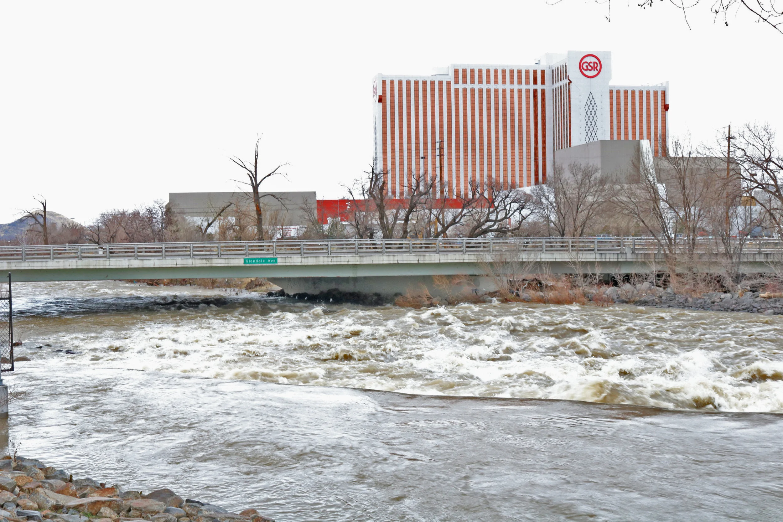 The Truckee River rages across from the Grand Sierra Resort earlier this week . Many tents can be found nestled in this area. Most of the residents of this small tent city left their belongings and found shelter elsewhere as the river rose earlier this month . 
