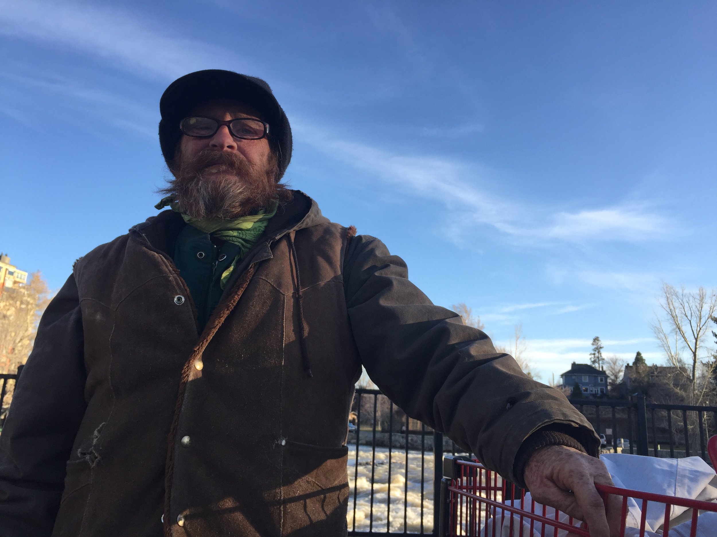 Leroy says "One Love" is another greeting of choice he likes to use. "This is all the stuff I got left in life," he said of his belongings in his shopping cart. Photo by Danielle DeRosa