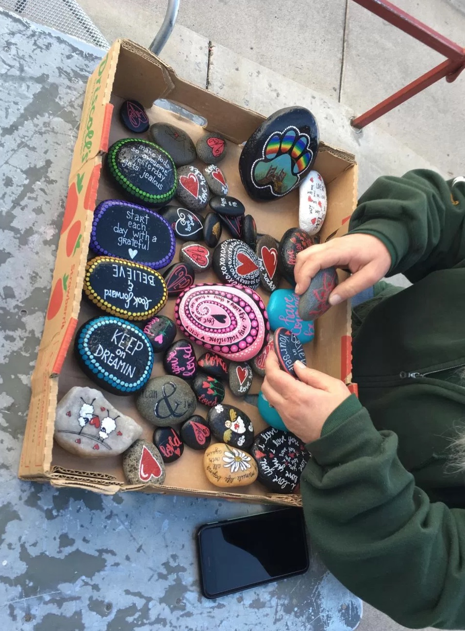 Handrich-Walker, who says she has planted hundreds of rocks around Reno since the group was founded, added that the time it takes to paint a rock depends on its size. She said it can take anywhere from one to two hours or several minutes. Photo and reporting by Kevin Sheridan shared with Our Town Reno.
