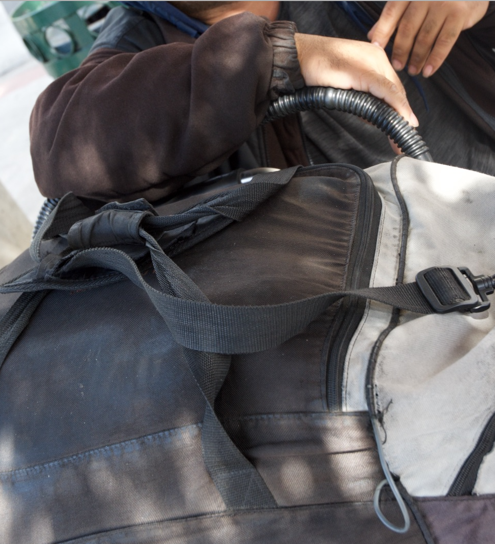 J.D. says he prefers to keep his belongings with him at all times. “I have food and clothes because I'm living outside. I have everything that keeps me warm inside the bag.”