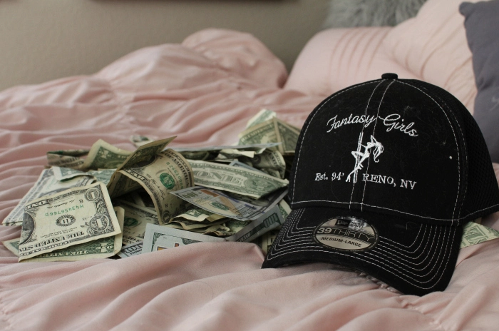 One dollar bills and club merchandise are also part of Gigi’s room decor.