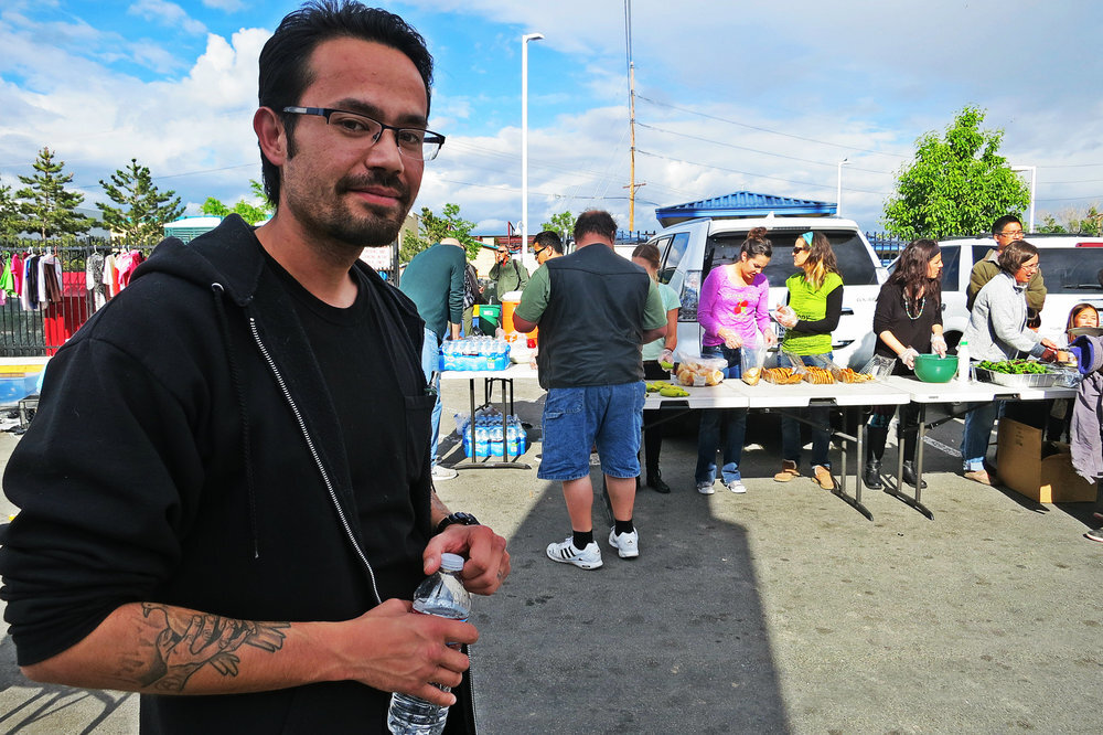 According to its website, RISE and Dine happens every Saturday (except the second Saturday of each month) from 5:00pm to 6:00pm. Pictured is Benjamin Castro, the RISE Board of Directors President, in an archive Our Town Reno photo at one of the meals.
