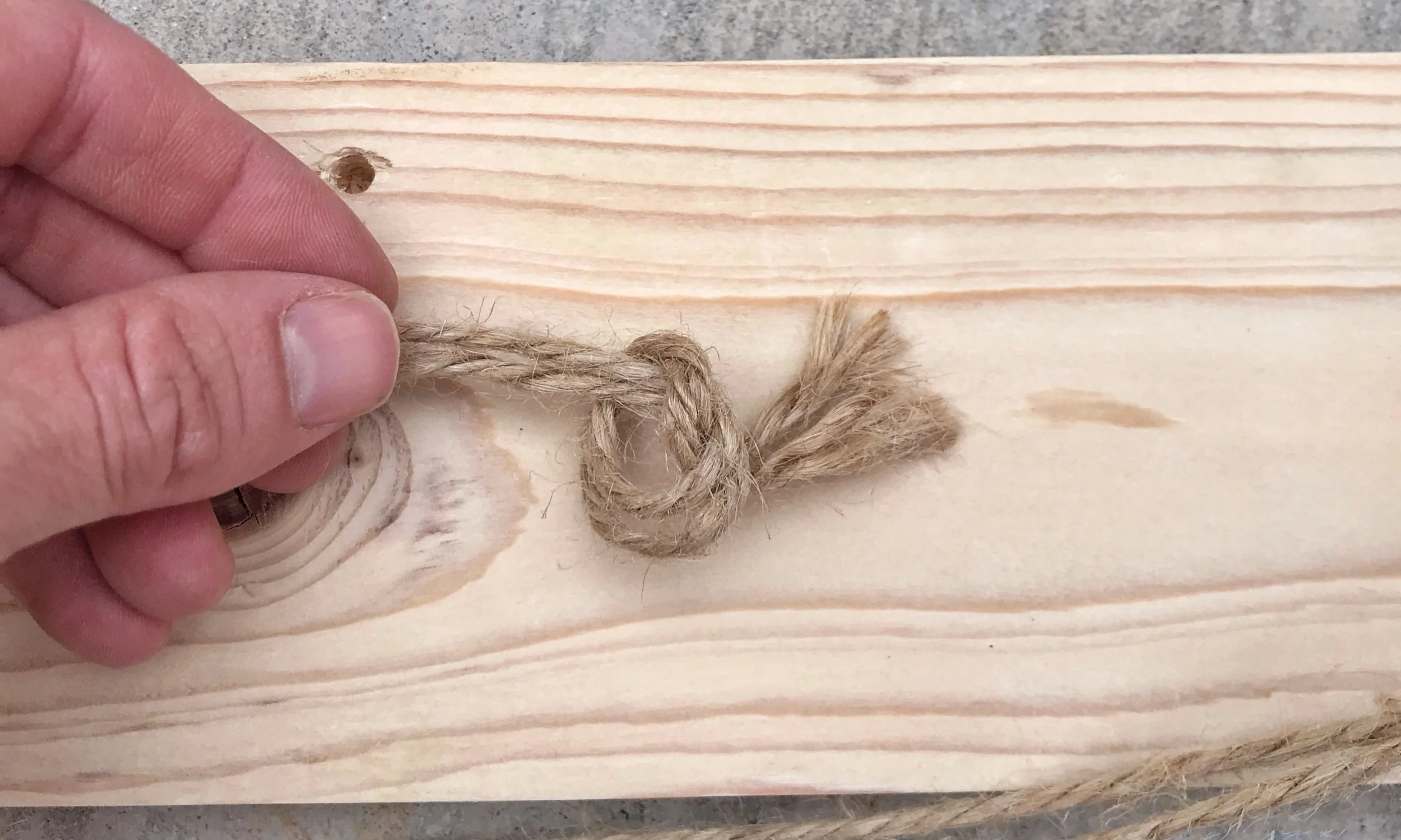 Just a simple knot will do. Then, trim the extra.
