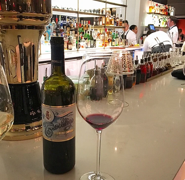 Sampling a delicious Teroldego wine from the Trentino-Alto Adige region of Italy. 