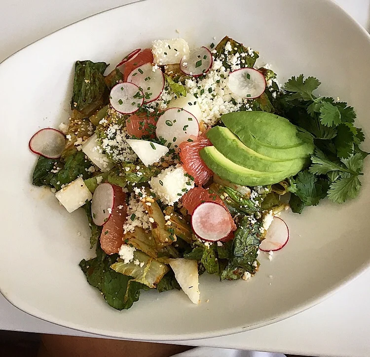 romaine chopped salad with avocado, grapefruit, jicama, almond and queso fresco with a chili vinaigrette