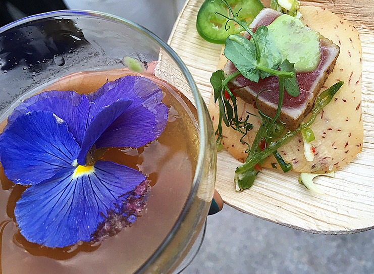 Cafe Boulud 's spiced yellowfin tuna with hearts of palm, taro root, jalapeno and chimichurri. Great with the Courvoisier cocktail!