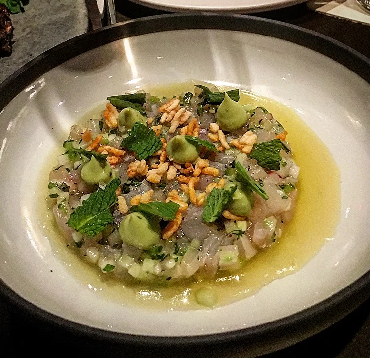 Wahoo crudo with pineapple, lime, cucumber, tarragon, mint and avocado puree