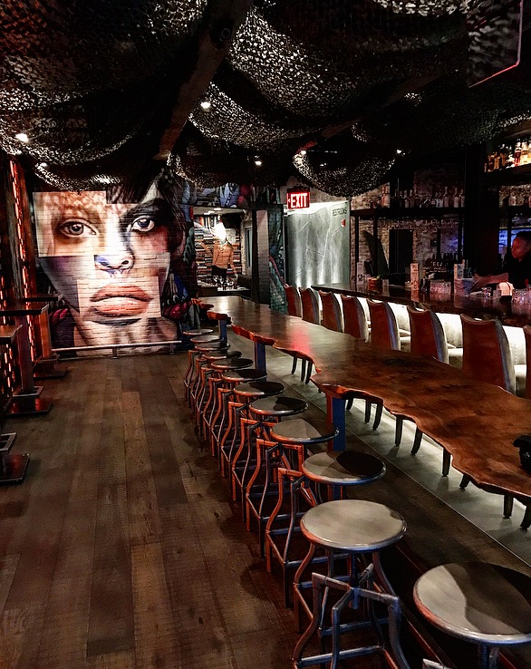 A Gorgeous, trendy bar at The Tuck Room. At night, the whole place is glowing with candlelight.
