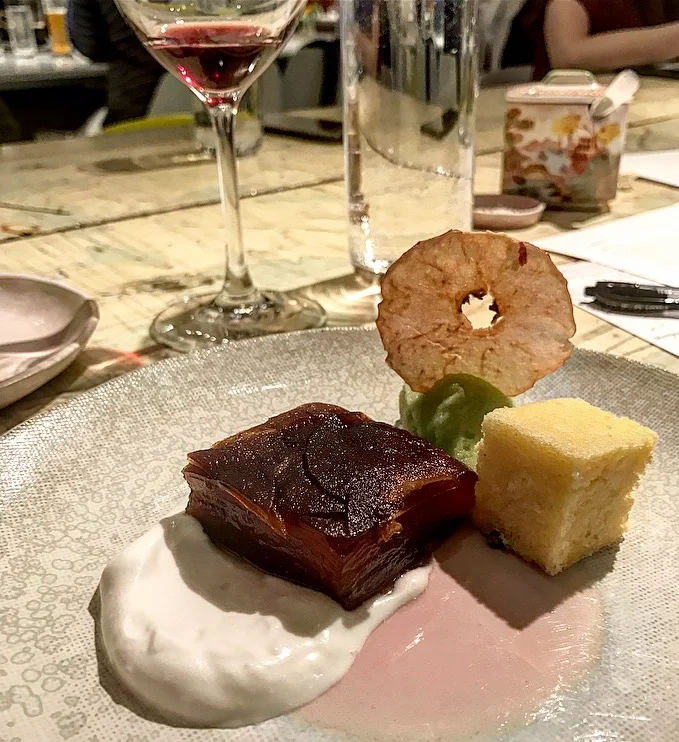 The apple confit dessert was the perfect ending. The apple was like a caramelized gel and it came with pound cake, green apple sorbet and whipped cream. Notice the beautiful, garnet red Beaujolais wine in the glass.