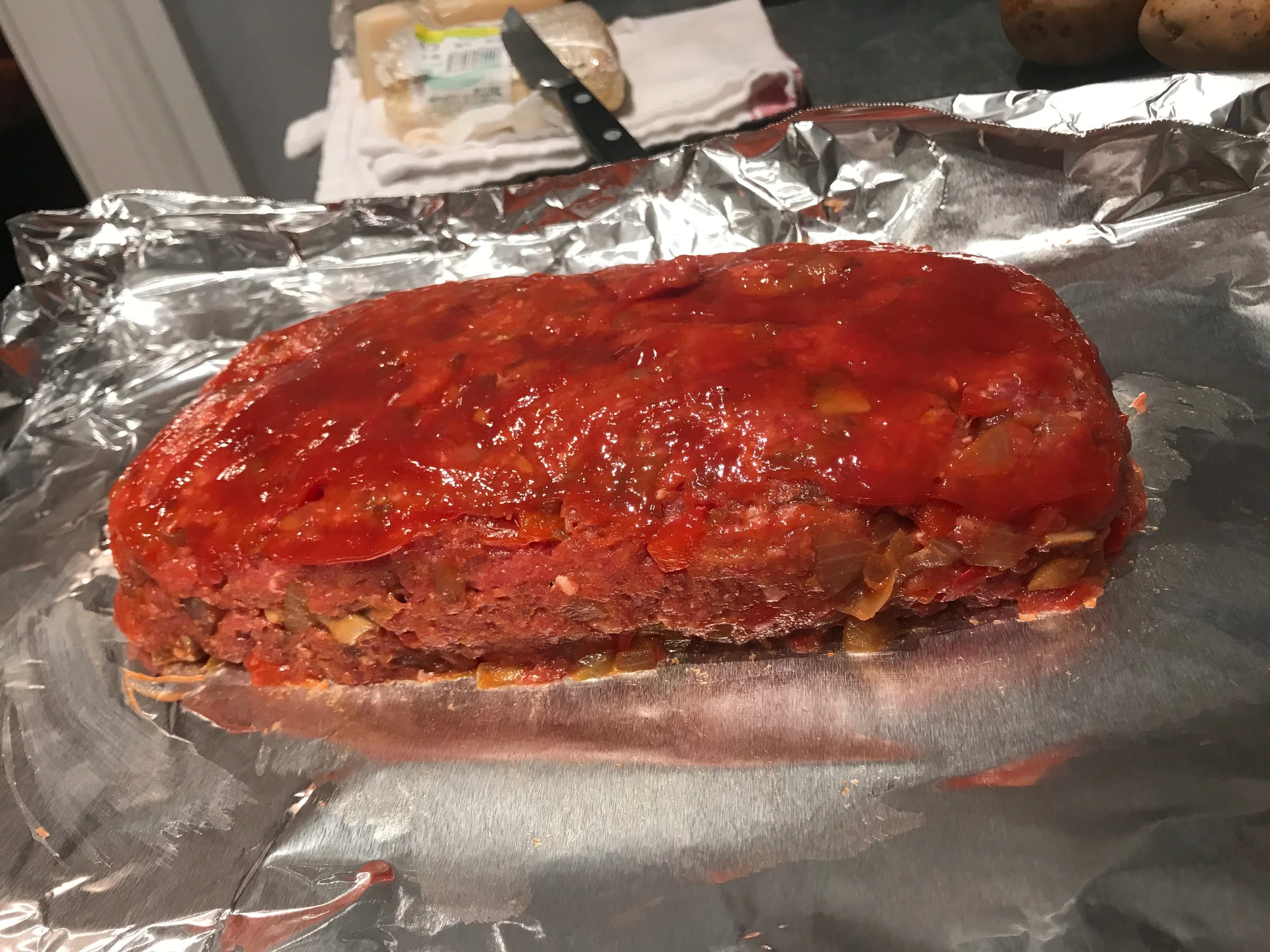 Meatloaf brushed with ketchup