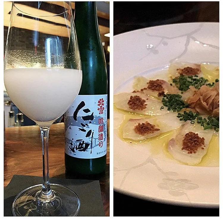 Unfiltered sake with fluke crudo at Nobu 57.