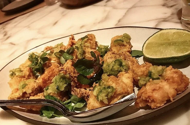 Lightly fried calamari with a ginger scallion sauce at Jean-George's new spot, Public