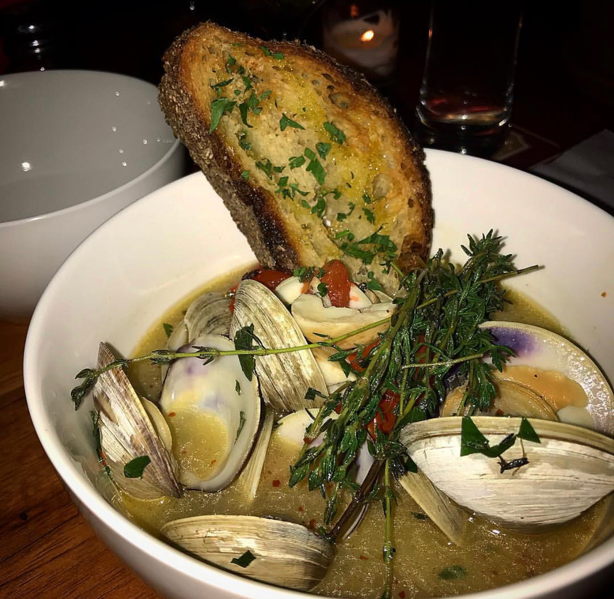 Bin 71’s clams in broth with garlic toast.