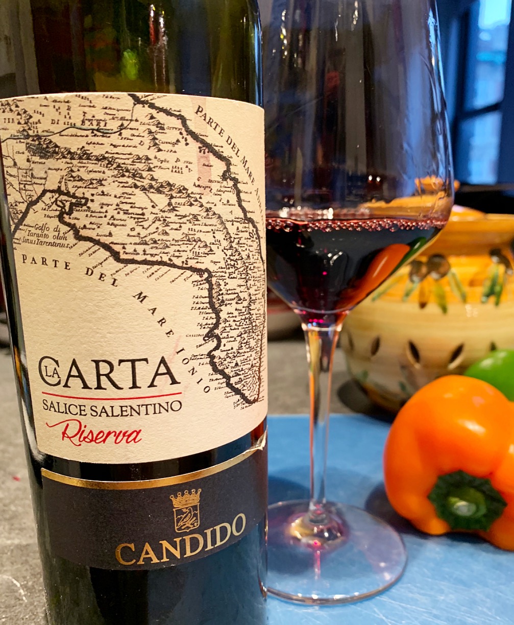 The Salice Salentino red Riserva wines age for a minimum of 24 months, including 6 months in barrel. This one from Candido winery was matured in large oak casks. The “La Carta” (“the map”) label depicts an ancient map showing Salento, surrounded by the seas. a pretty ruby red color, this wine has beautiful smells and tastes of bright fruit, like a cherry pie, with baking spices, herbs (mint), and tobacco. delicious served with pasta and red meat ragout. (Wine samples provided by the Consortium for Salice Salentino wine)