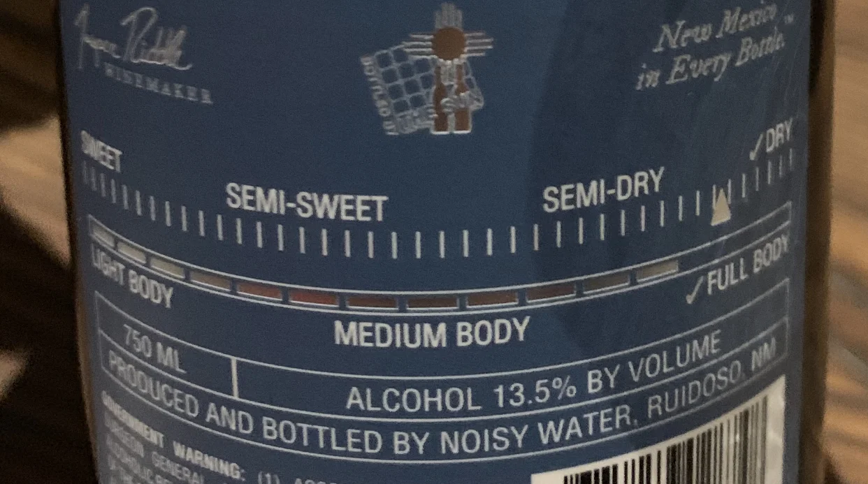 The back labels of Noisy Water Winery let you know how sweet or dry the wine is.