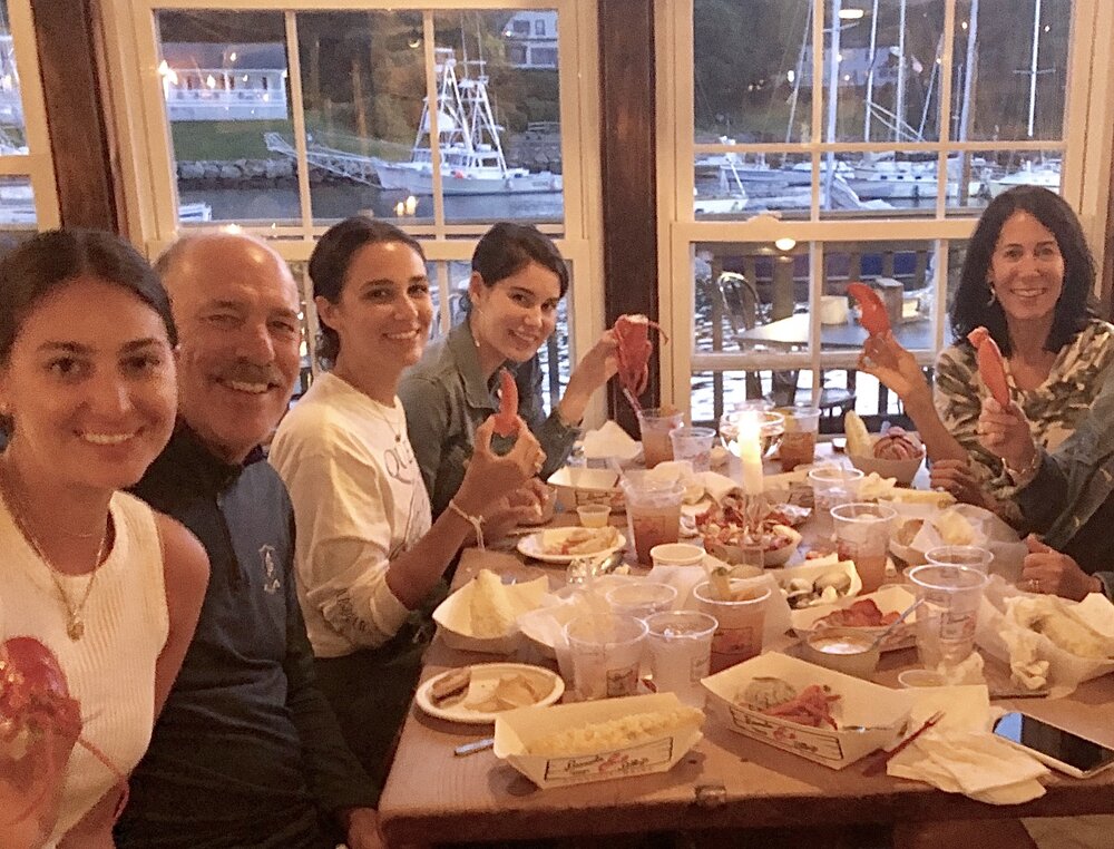 The author and her family enjoying Maine lobster during better days.