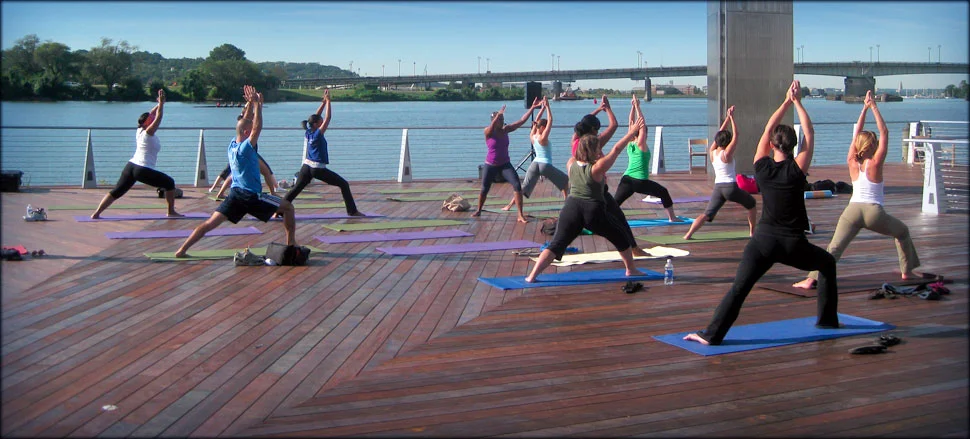 The Yards acomodate all sorts of programs, which drive usage and encourage neighbors to visit and people watch. Here, a Yoga class with views of the Anacostia river.