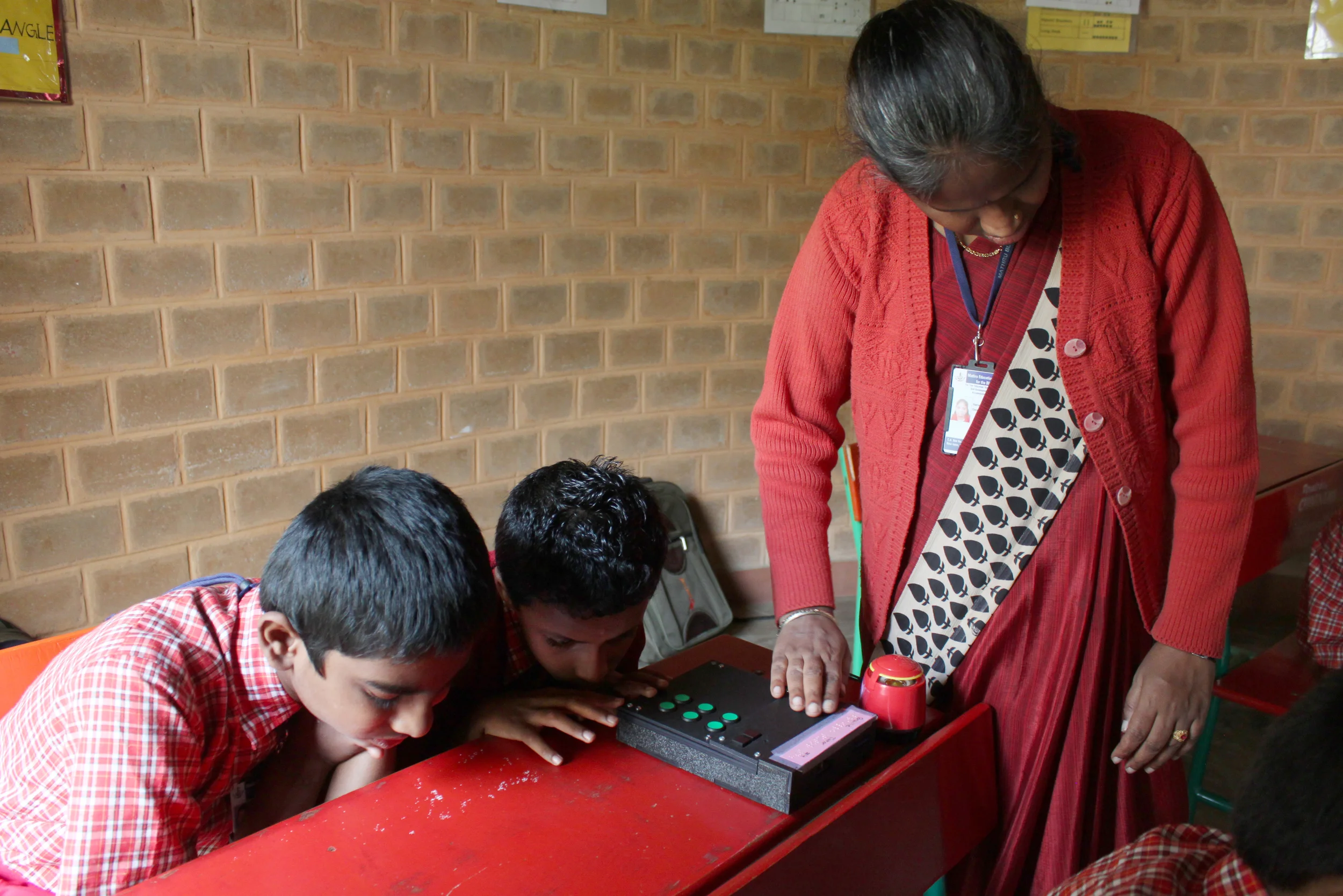 Observing a classroom use the Stand-Alone Braille Tutor during a class. The teacher pictured above is also blind, but an incredibly strong-willed and commanding teacher.