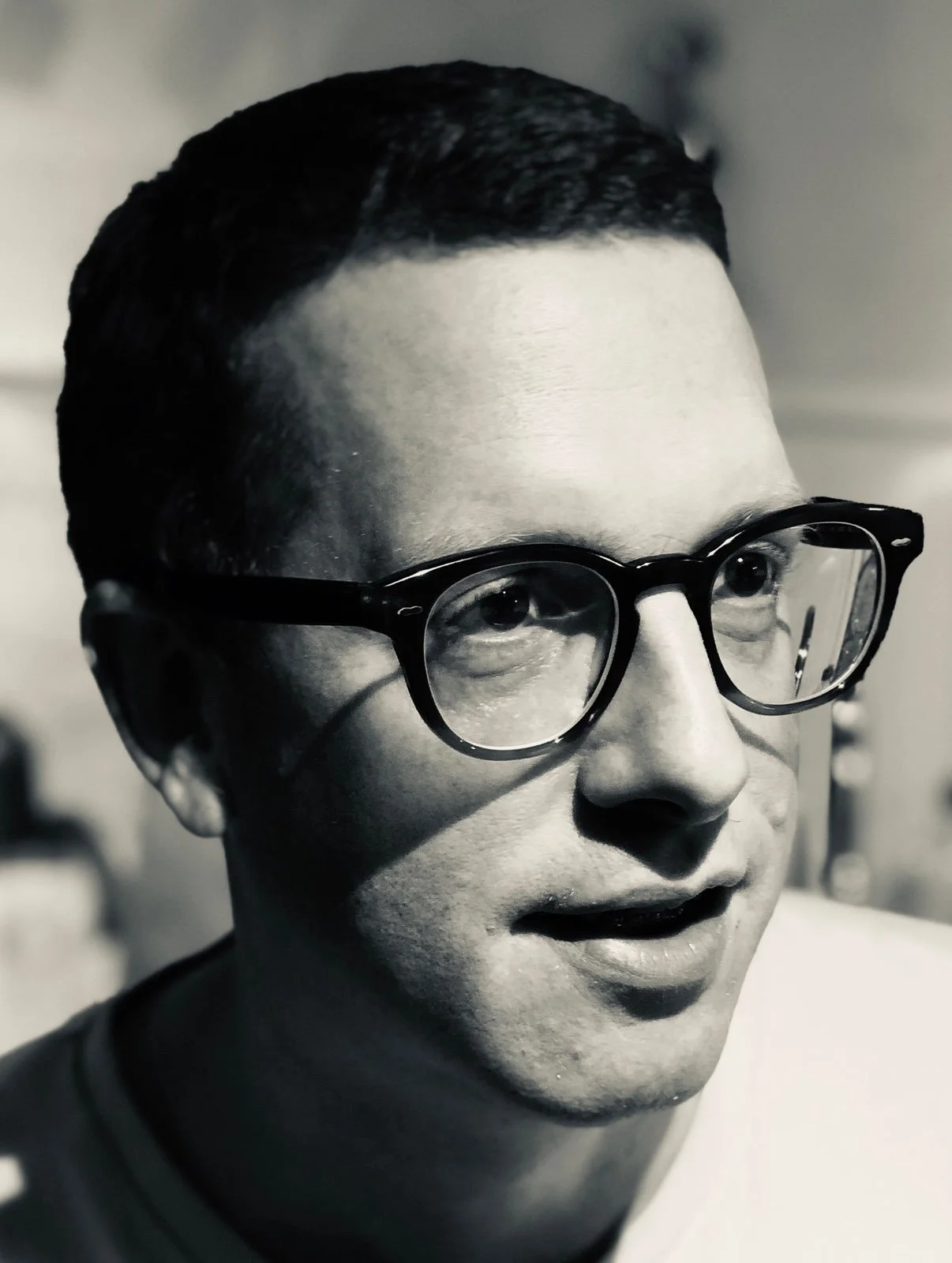 Black-and-white portrait of Evan Jolly