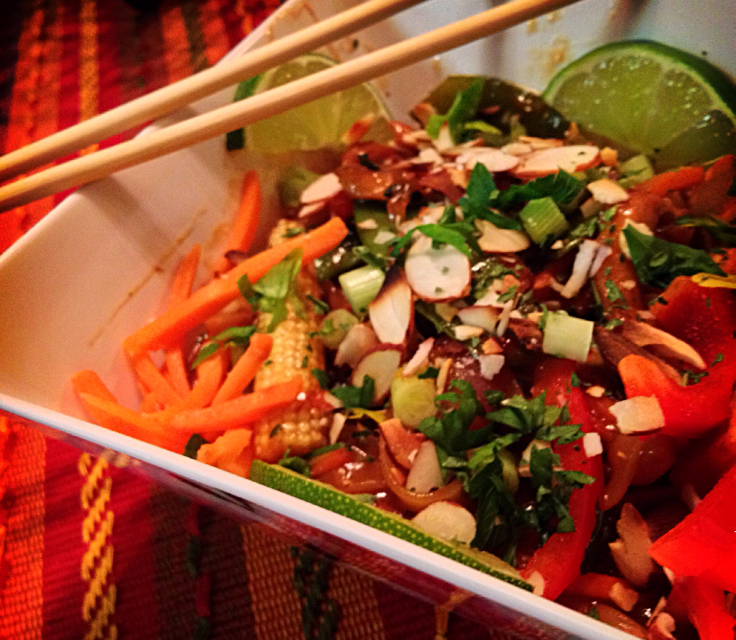 "Pad Thai with sliced almonds as garnish"