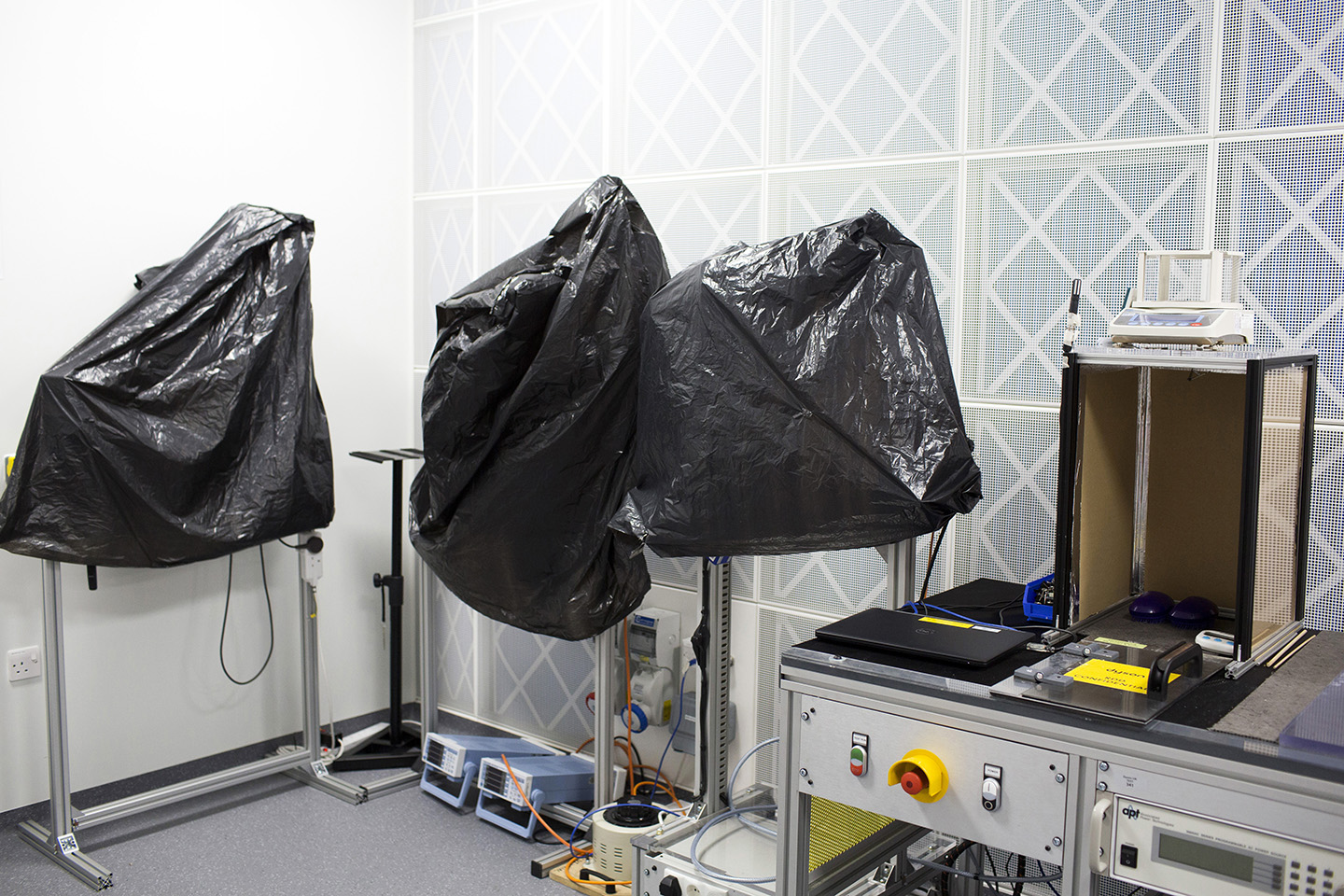   The hair science research lab with black bags over new inventions.   