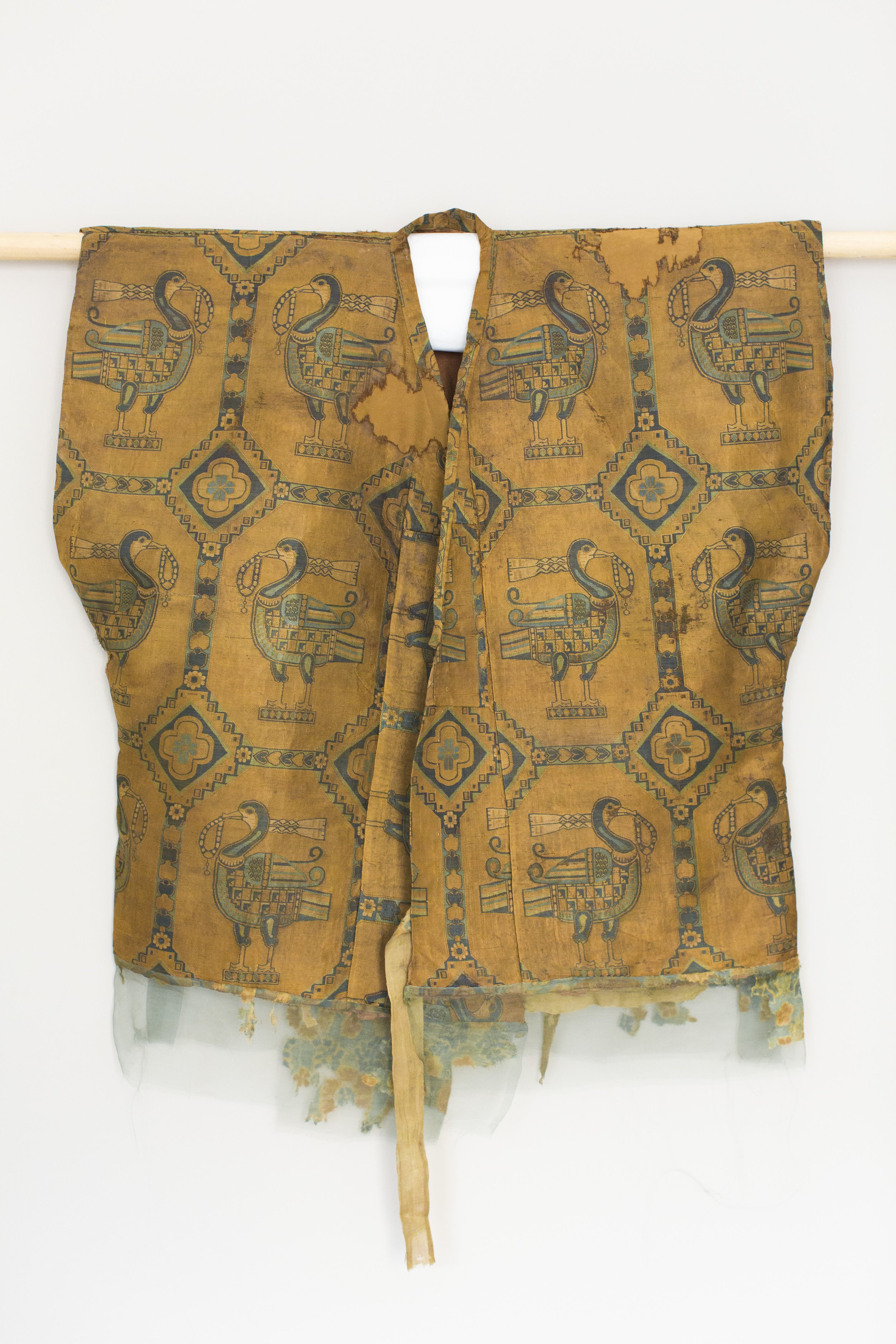   A 1,000-year-old, one-of-a-kind golden silk samite shirt, which was decorated with ducks wearing scarves and holding pearl necklaces in their beaks.  