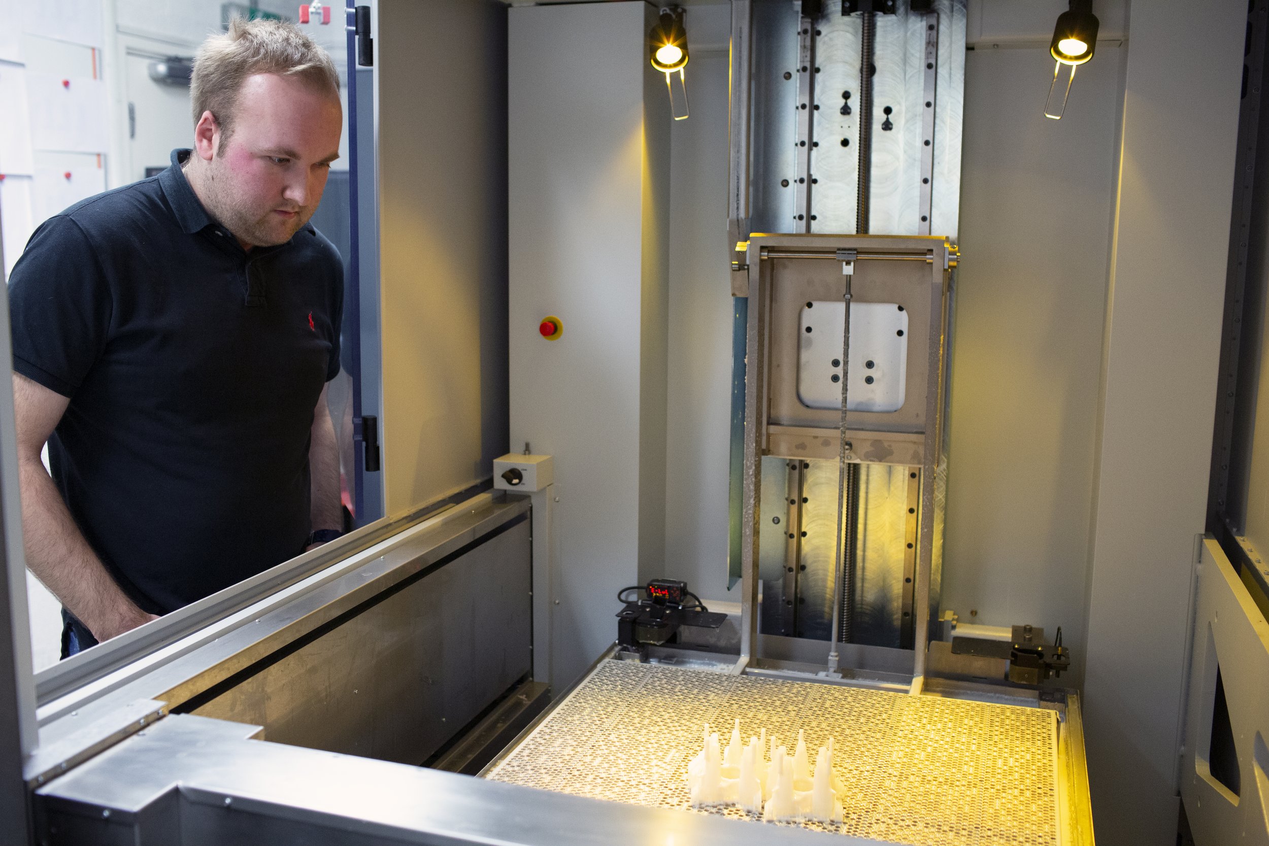   Inside the stereolithiography machine  lab which makes 3d printed parts using resin.   