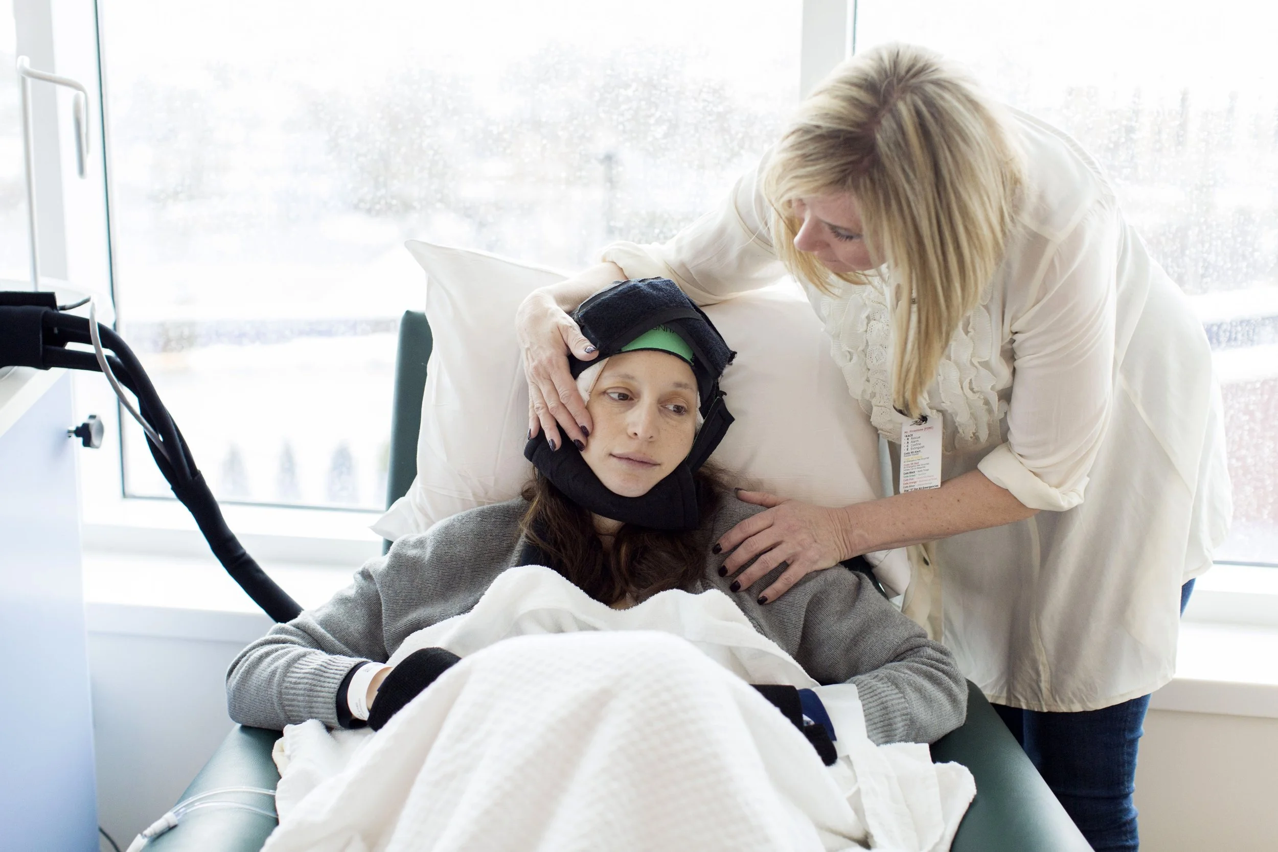 A patient wearing a DigniCap, a scalp cooling system that uses a cap to reduce hair loss during certain types of chemotherapy.