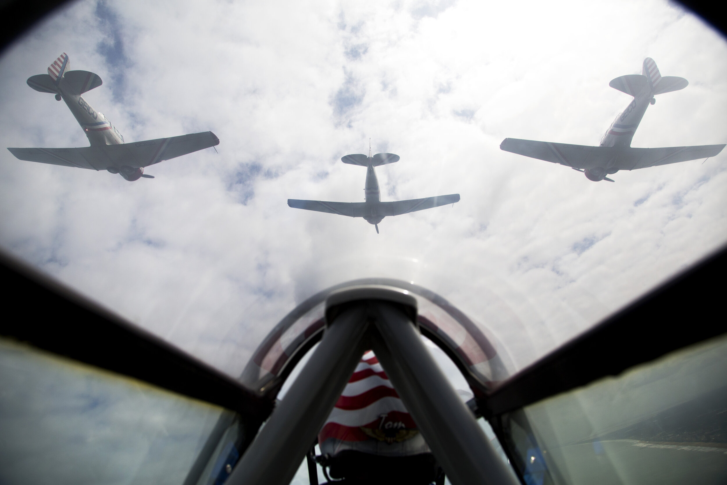  Pilot Tom Daly brings up the rear of the diamond formation as the GEICO Skytypers Air Show Team flies over Virginia Beach, VA, on September 19, 2019. The vintage squadron is made up of six WWII-era aircrafts and performs in air shows across the coun