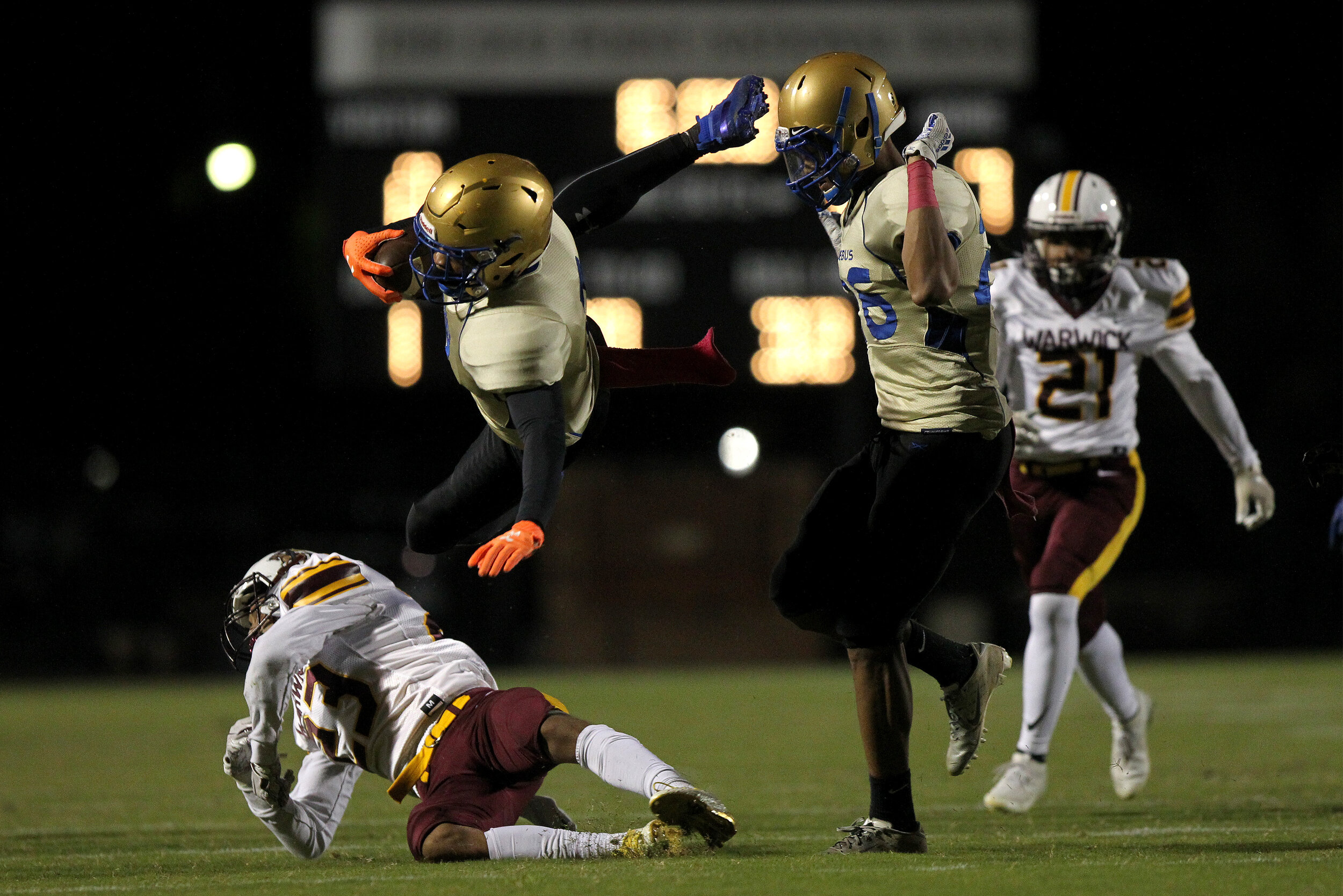  Phoebus' Anthony Turner, #7, is tripped by Warwick's Jeyson Campusano, #23, during the first quarter of their varsity game at Darling Stadium in Hampton, VA, on Friday, October 18, 2019. 