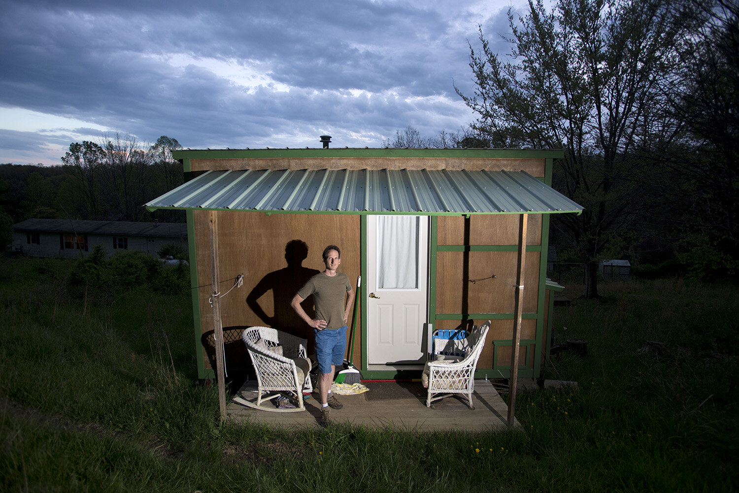  Kevin Polk poses for a portrait with his tiny house he formerly lived in, that he to helped design and build. 