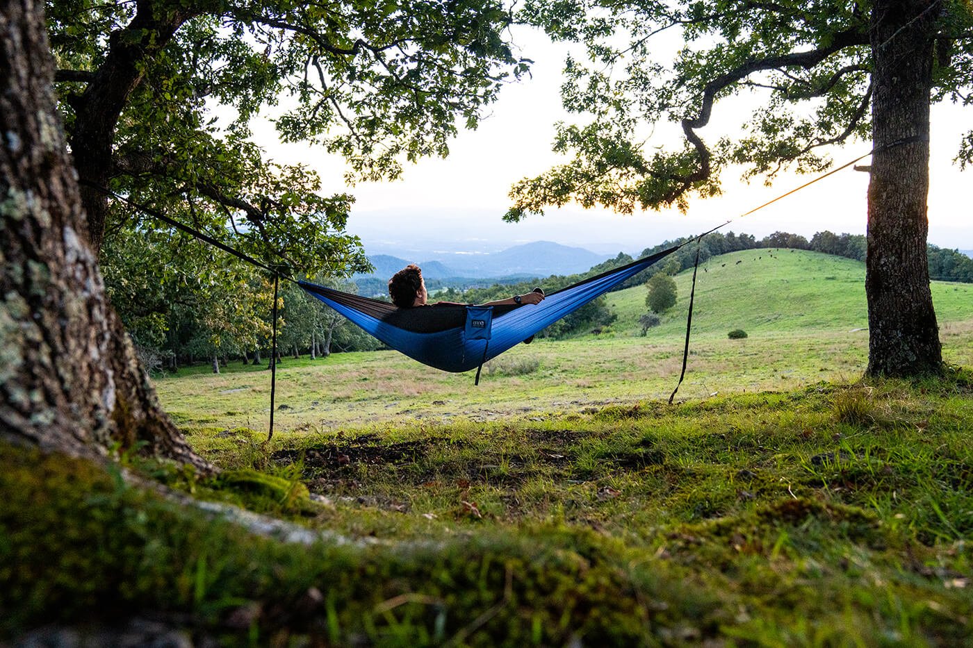  Brandon Yoho watches the sunset on Bearwallow Mountain from the comfort of his ENO hammock in September 2022.  