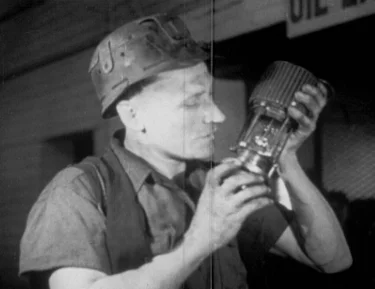Melodic Miner adjusting his condenser mic prior to blasting a seam.