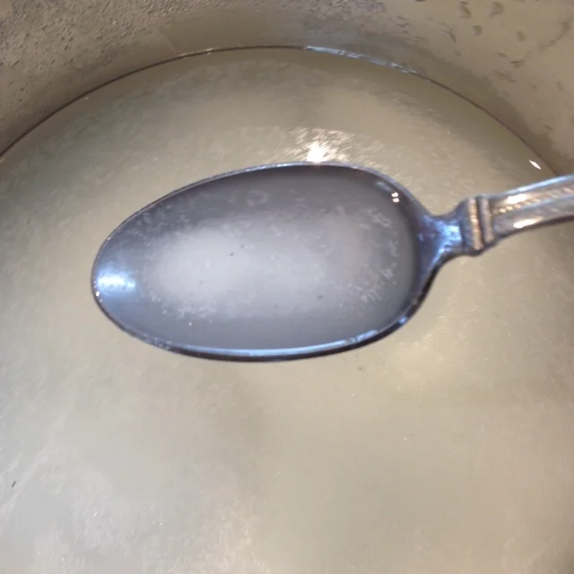 It takes awhile to dissolve it thoroughly, but persist and add a bit more water until the mixture is clear.