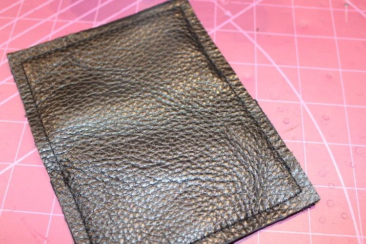 Black leather sample stretches and 'grows'. Not the best result but the leather is beautiful.