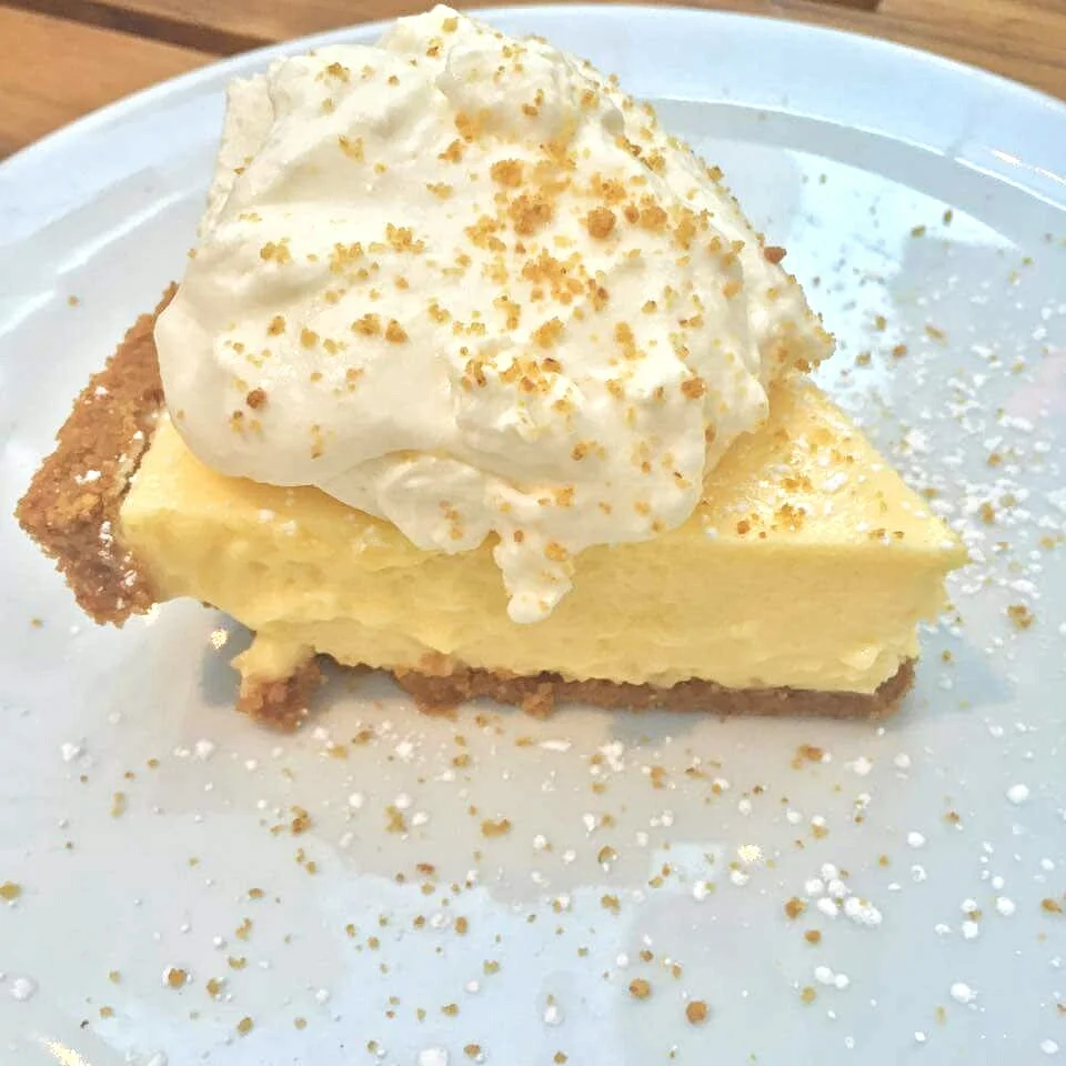 Key Lime Pie - freshly squeezed key limes, graham cracker crust, hand whipped cream. Cost - $8.25.