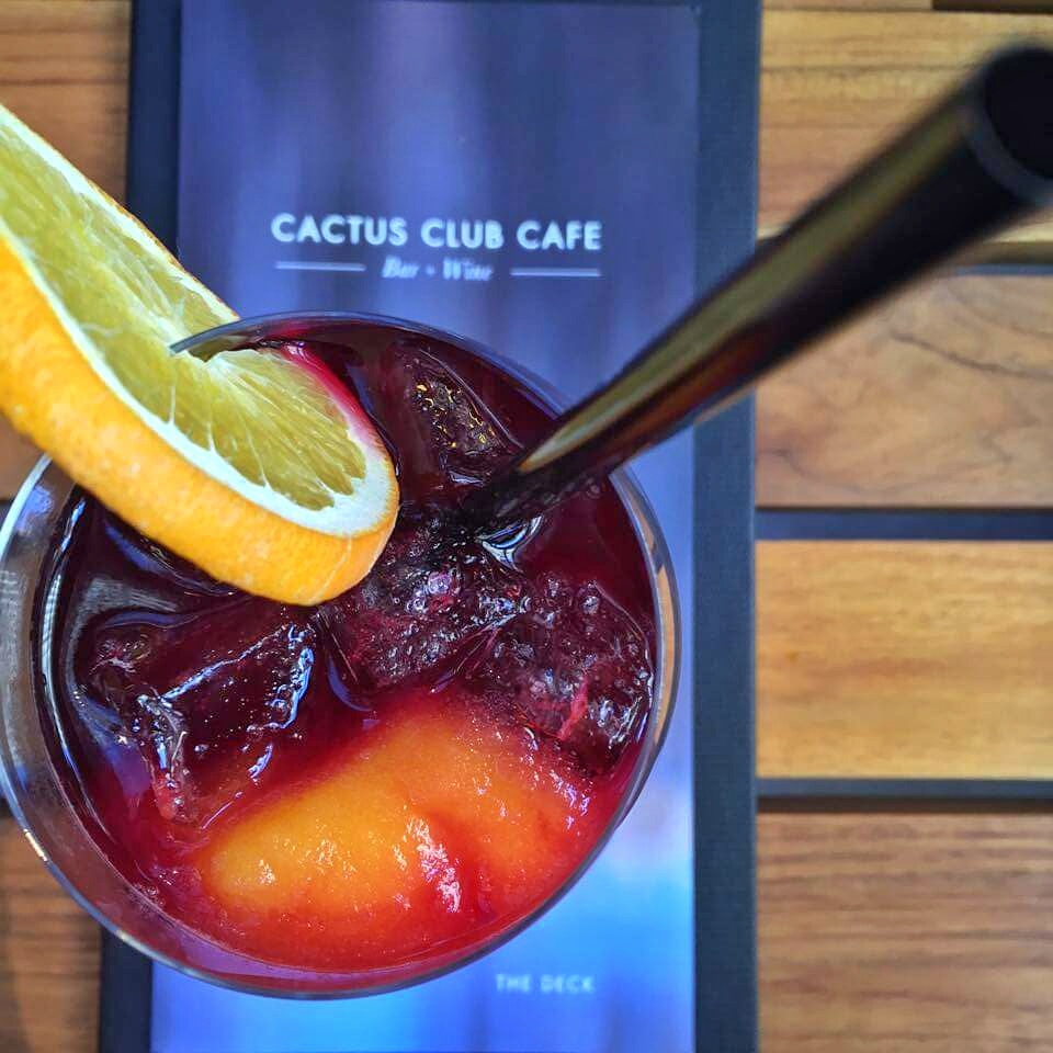 Signature Sangria - fresh strawberries and raspberries, zinfandel, apricot brandy, sprite and a splash of bellini. Cost - $10.50.