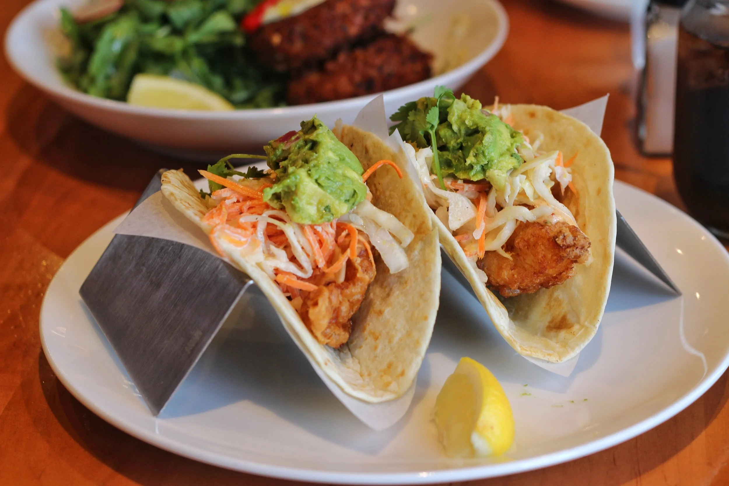 Baja Fish Tacos – beer battered white fish, 2 homemade flour tortillas, citrus slaw, chipotle aioli, guacamole