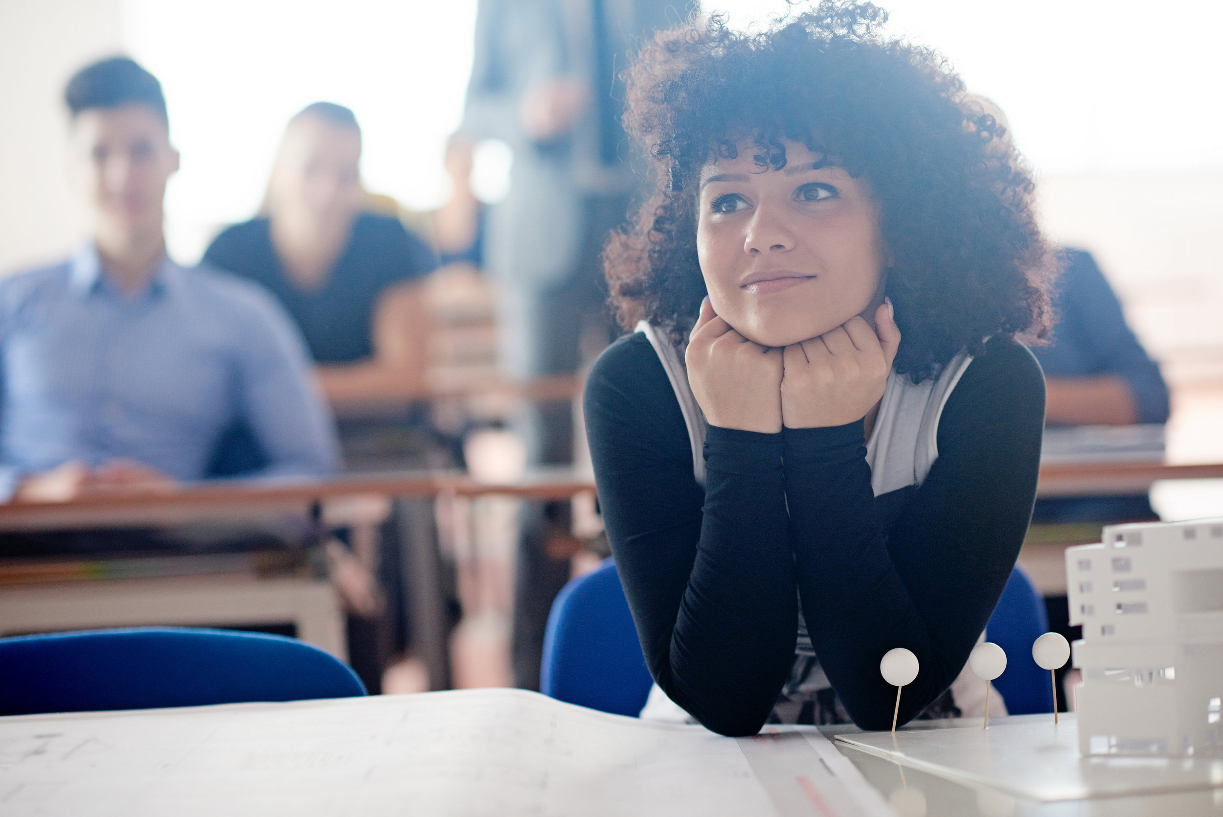 portrait of young female student at school classroom