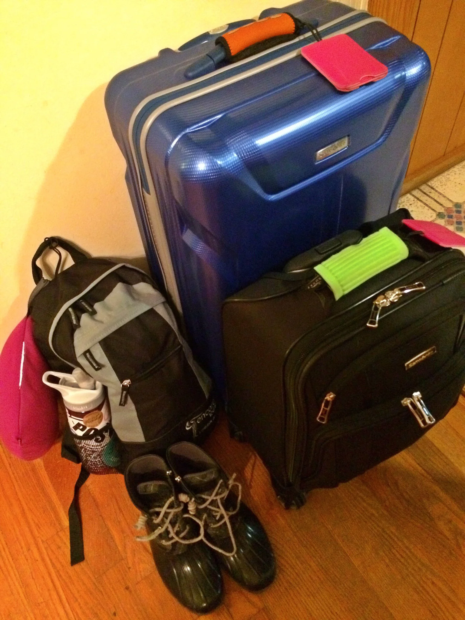 Bright colors, bags, and boots for my adventure overseas.